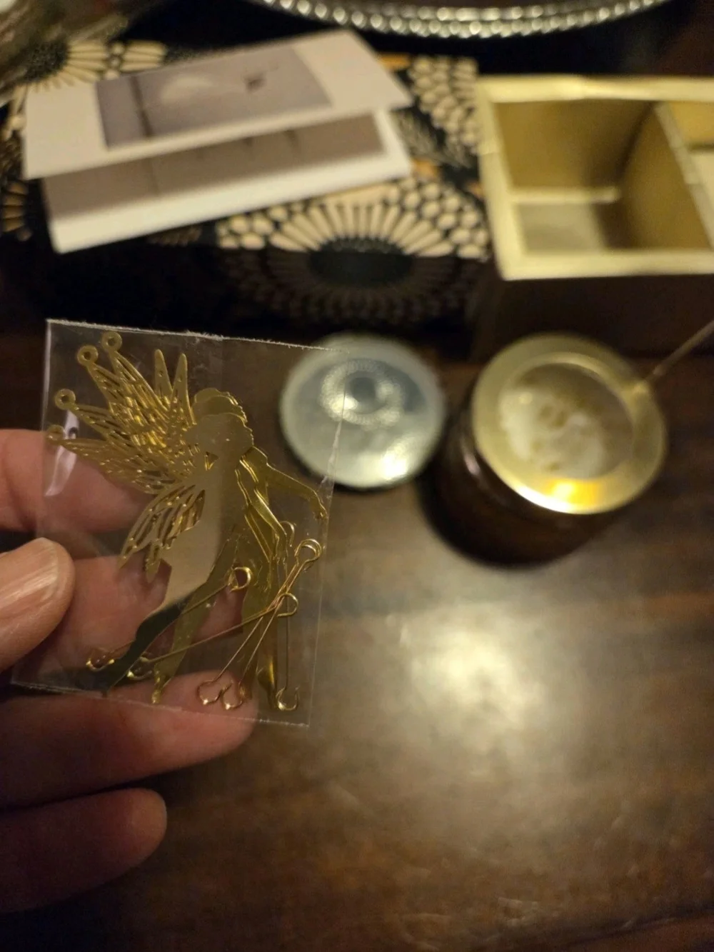 Mecela Golden Spinning Candle Holder, featuring hanging metallic fairies